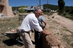 Jake Barrow mudding a wall at the historic church in Las Trampas, NM (photo courtesy Jake Barrow)